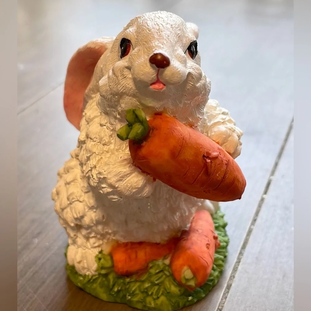 Cute rabbit with carrots statute - rabbit sparkles in light (see video)
